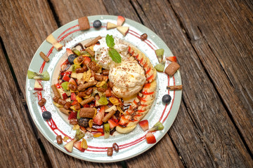 Pancake fruit salad with ice cream