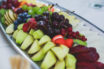 Decorated catering banquet table with different food appetizers assortment on a party

