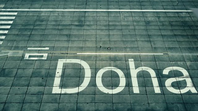 Aerial view of big airplane arriving to Doha airport. Travel to Qatar conceptual intro animation
