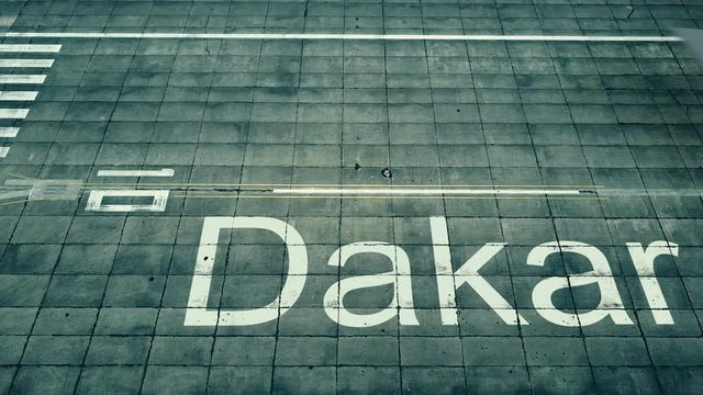 Aerial view of big airplane arriving to Dakar airport. Travel to Senegal conceptual intro animation