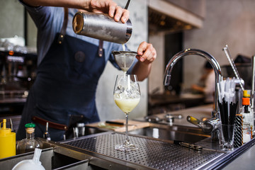 Barman at work, preparing cocktails. concept about service and beverages