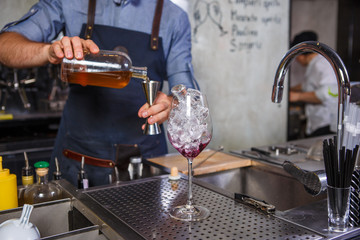 Barman at work, preparing cocktails. concept about service and beverages