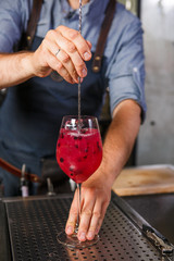 Barman at work, preparing cocktails. concept about service and beverages