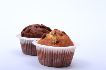 Fresh homemade muffins on white background. Top view.