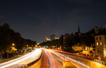Fototapeta na wymiar Streams of headlights on Storrow Drive in Boston