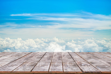 Wooden table with blue sky background