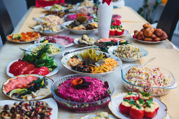 Decorated catering banquet table with different food appetizers assortment on a party
