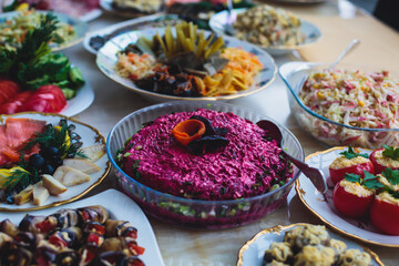 Decorated catering banquet table with different food appetizers assortment on a party
