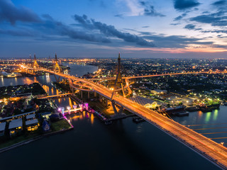 Fototapeta premium Aerial view Road roundabout with car lots in Thailand.Aerial view Bhumibol Bridge in Thailand.
