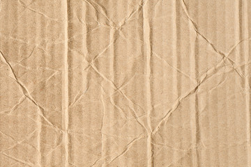 Closeup texture of crumpled cardboard plate brown wallpaper background