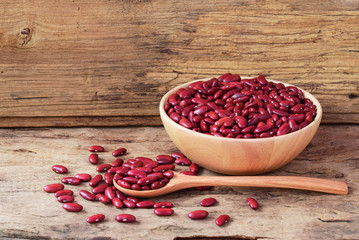 Red Kidney Bean in wooden spoon and wooden bowl on wooden background