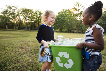 Little Kids Separating Recycle Can to Trash Bin