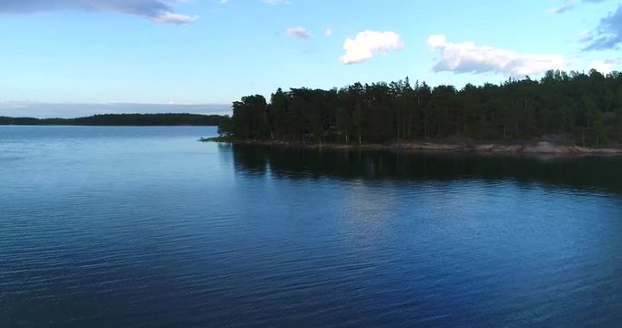 Archipelago, Cinema 4k aerial over a island revealing the finnish saaristo, on a sunny summer evening, in houtskari of the finnish archipelago of Turku, Varsinais-suomi, Finland