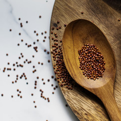 Closeup of quinoa in wooden spoon