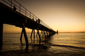 Fototapeta na wymiar bridge on the sea sunset