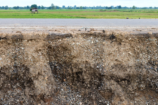 Soil layers under the road and paddy fields.