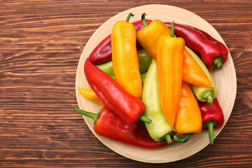 Fresh colored sweet peppers on the plate