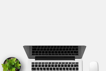 Modern workplace with notebook and little tree copy space on gray background. Top view. Flat lay style. © itim2101
