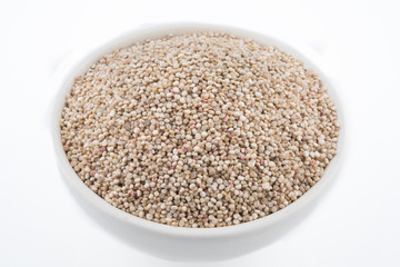 Chenopodium quinoa Seeds in a Bowl. Raw quinoa seeds in a  bowl from above,on white background..