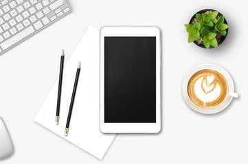 Modern workplace with notebook, smartphone, tree, pencil, blank paper and coffee cup copy space on gray background. Top view. Flat lay style.