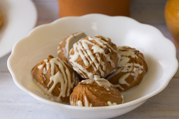 Gingerbread in a white bowl. A delicious festive dessert. Baking and confectionery. Christmas time.