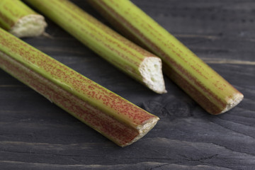 A rhubarb on a wooden table. Healthy food.