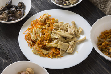 Asparagus in Korean with a carrot in a white plate. Korean cuisine.