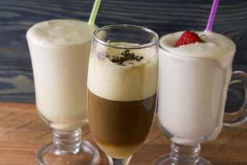 Eggnog on a wooden table. A festive egg drink. Christmas time.