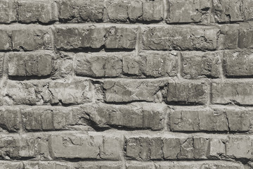 Old, worn brick wall. Background with a textured surface.