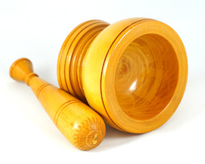 wooden mortar and pestle on white background 