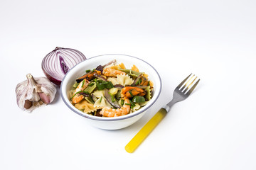 Green tagliatelle with seafood. Mussels; Prawns. Isolated