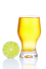 A healthy diet and lifestyle concept:  Yellow fruit juice with lime isolated on white. Closeup.
