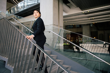 young businesswoman climbing up the stairs.
