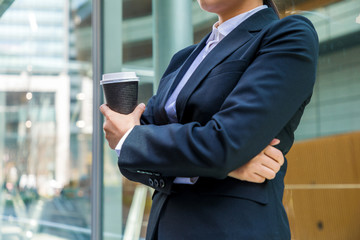 young businesswoman drinking a cup of coffee.