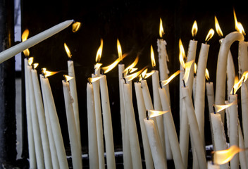 Wax candles lit with fire