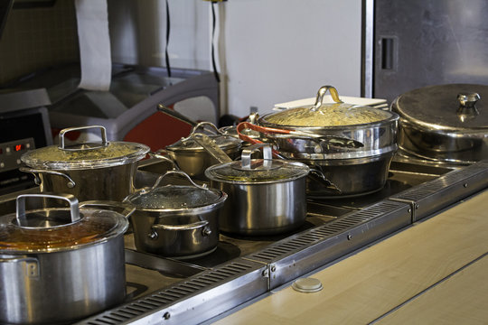 Pans and pots preparing food in a kitchen