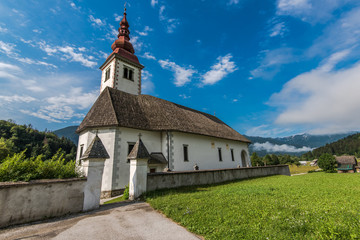 Fototapeta na wymiar Bitnje Cerkev in Slovenia Triglav Park at summer day