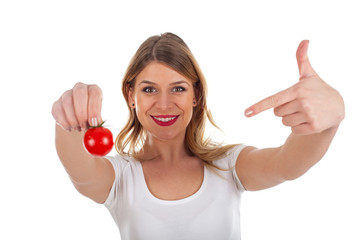 Cool girl holding a cherry tomato