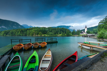 Colorful kayaks at lake Bohijn, Slovenia