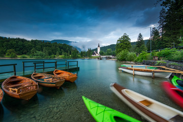 Colorful kayaks at lake Bohijn, Slovenia