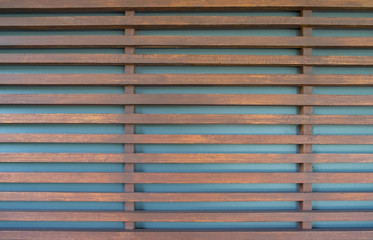Raw wood, wooden slatted fence or lath wall background.