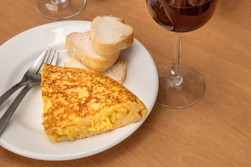 Spanish tortilla with wine, tapas in local bar