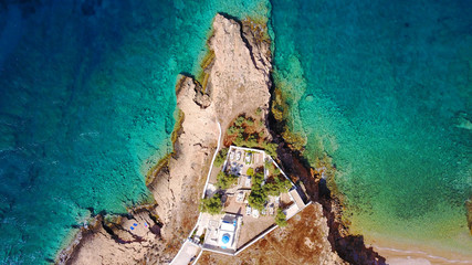 Aerial drone photo of small church of Agios Nikolaos and rocky seascape, Koufonissi island, small Cyclades, Aegean, Greece