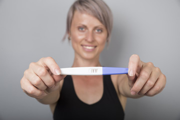 Woman holding pregnancy test, New life and new family concept.