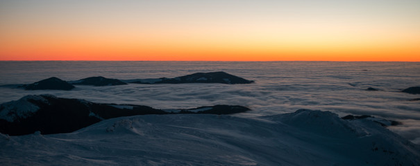 scenic sunrise, sunset in the winter mountains. mountain range