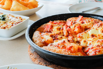 Hawaiian pizza on table 