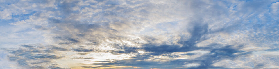 Vibrant color panoramic sun rise and sun set sky with cloud on a cloudy day. Beautiful cirrus cloud. Panorama high resolution photograph.