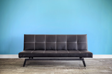 Front view of black leather sofa.