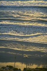 Three people illustrate the vastness of the Pacific Ocean