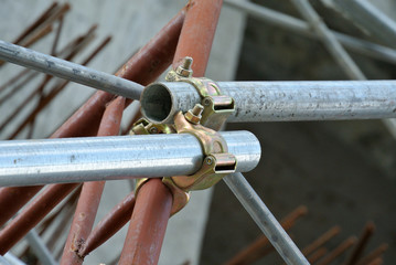 Scaffolding connector detail at the construction site. The connector bind or tie scaffolding or...